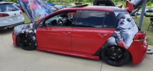 Red Volkswagen Jetta at Dub Splash